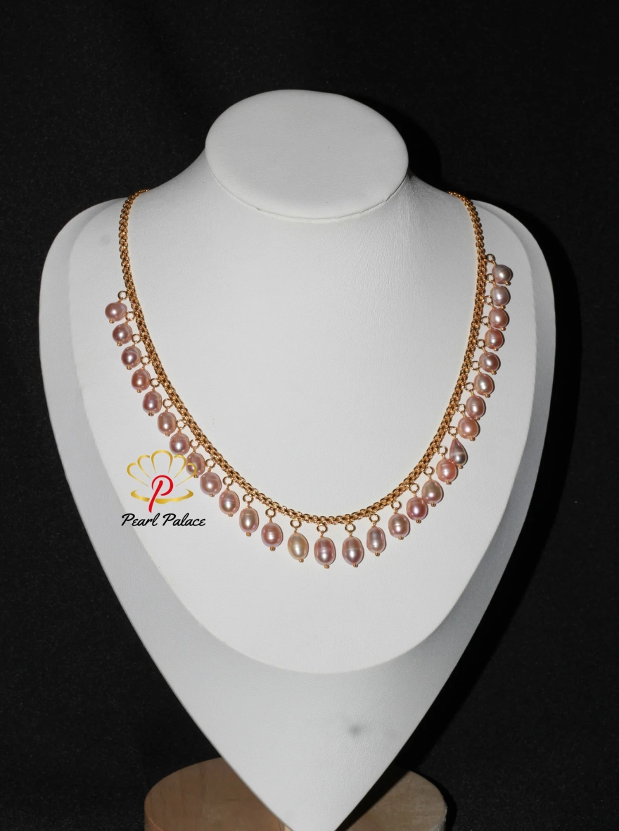 Peach Rice Pearl and Gold-Plated Necklace and Earring Set.